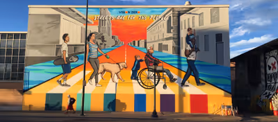 A mural on Colfax Avenue titled 'Streets Are For the People'